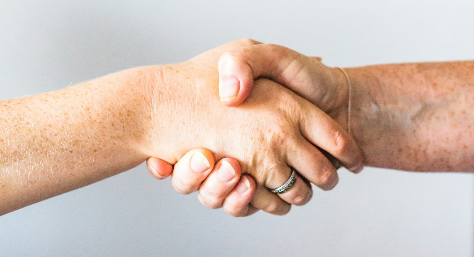 person holding hands of another person